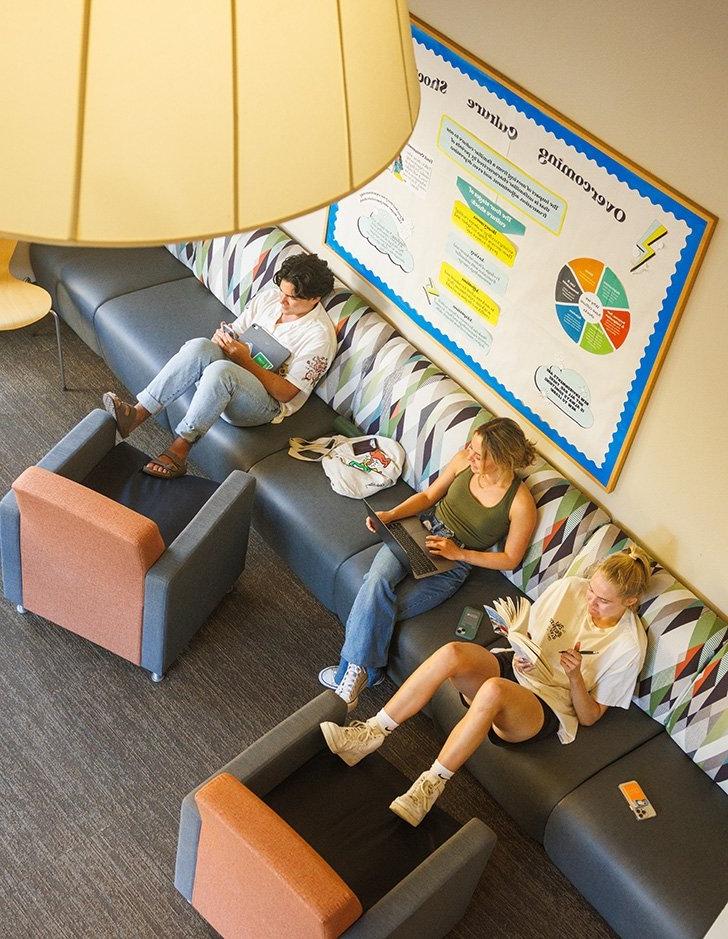 three students sit in the atherton study room